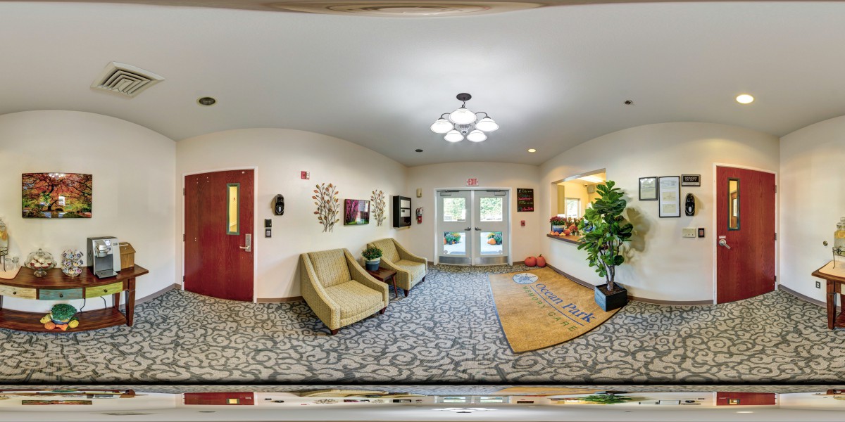 A spacious lobby with comfortable seating and decorative elements.