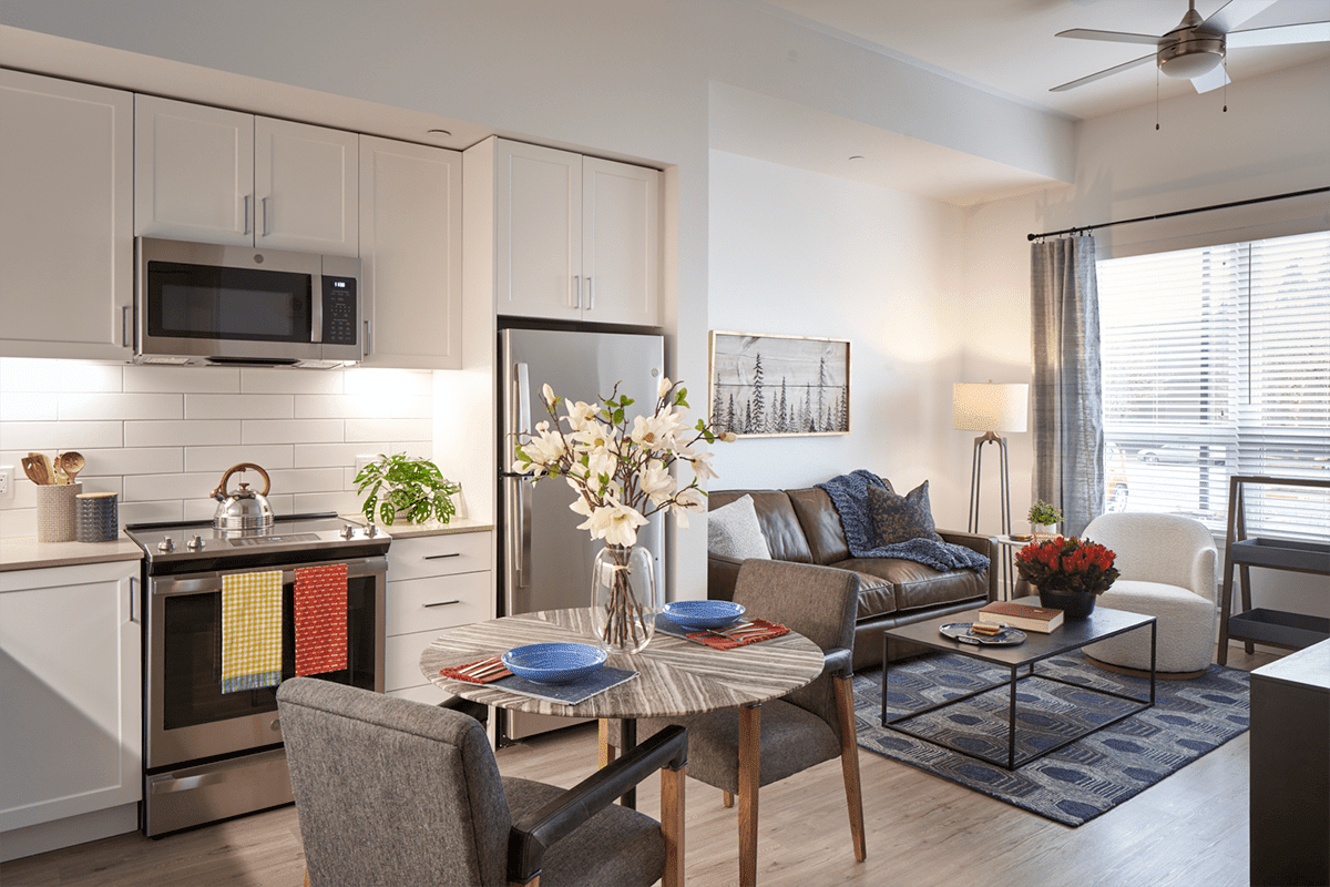 Modern apartment interior with living room and kitchen area.