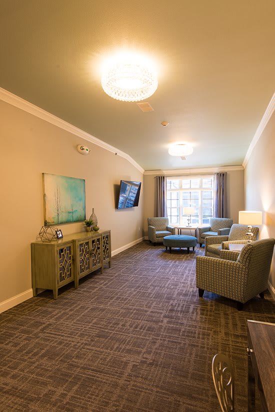 A cozy living room with comfortable seating and elegant decor.