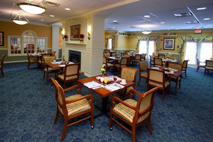 A cozy dining area with neatly arranged tables and chairs, perfect for a relaxed meal.