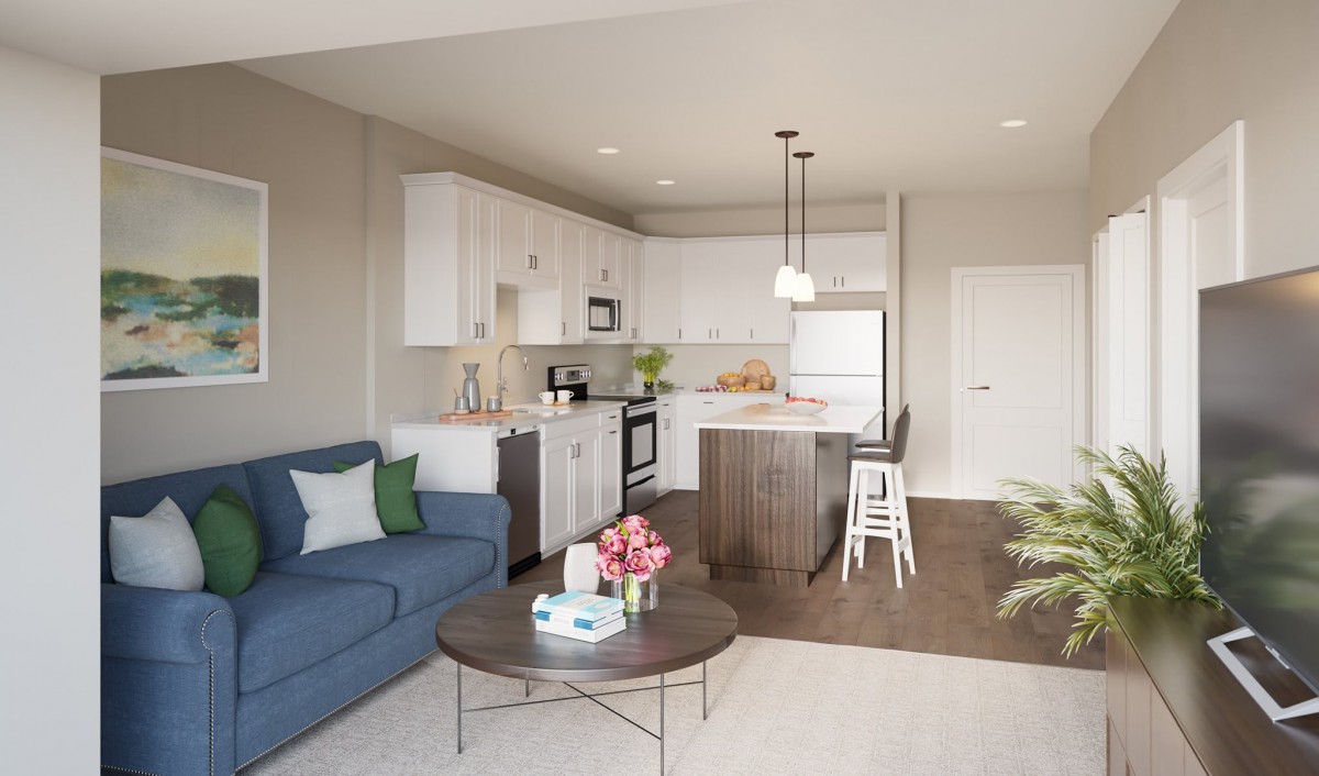 A modern open-concept living room and kitchen with neutral tones and contemporary furnishings.