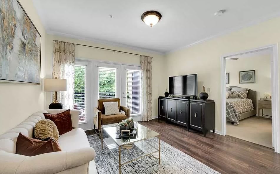 A modern living room with elegant furniture and decor.