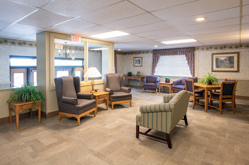 A cozy lounge area with comfortable seating and natural light.