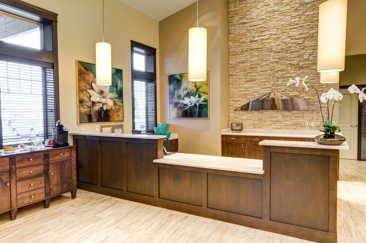 A modern reception area with stylish decor and warm lighting.