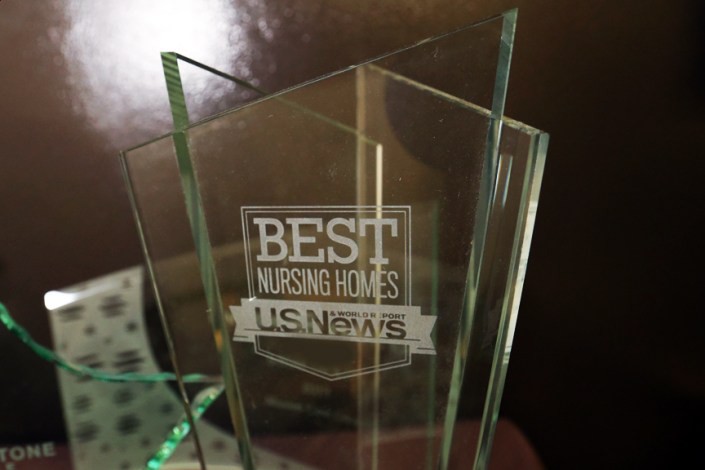A glass award from US News recognizing the best nursing homes.