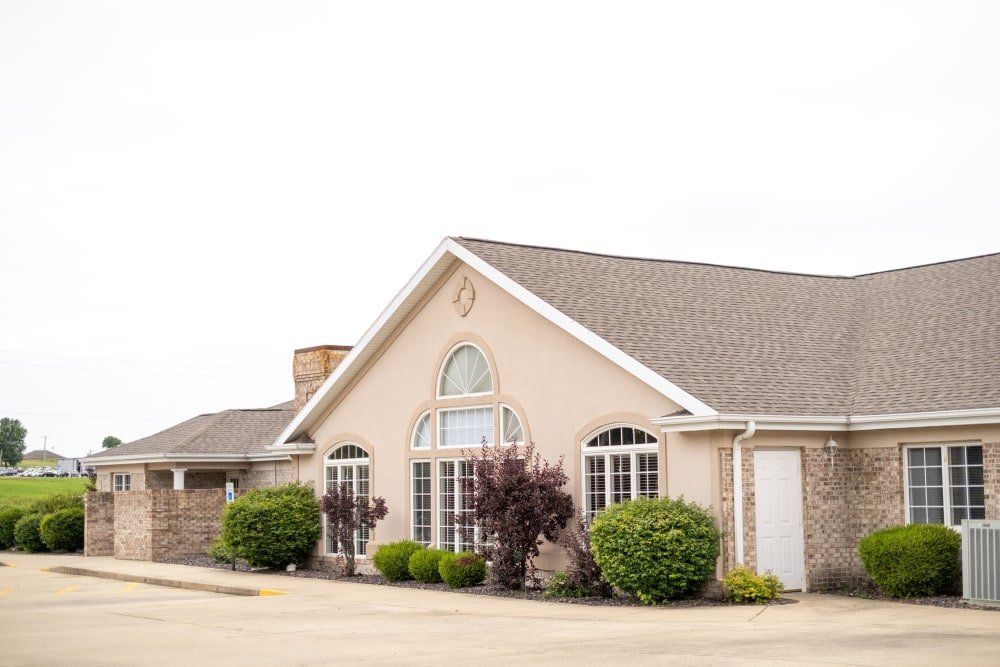 A suburban residential house with a well-maintained exterior and landscaping.