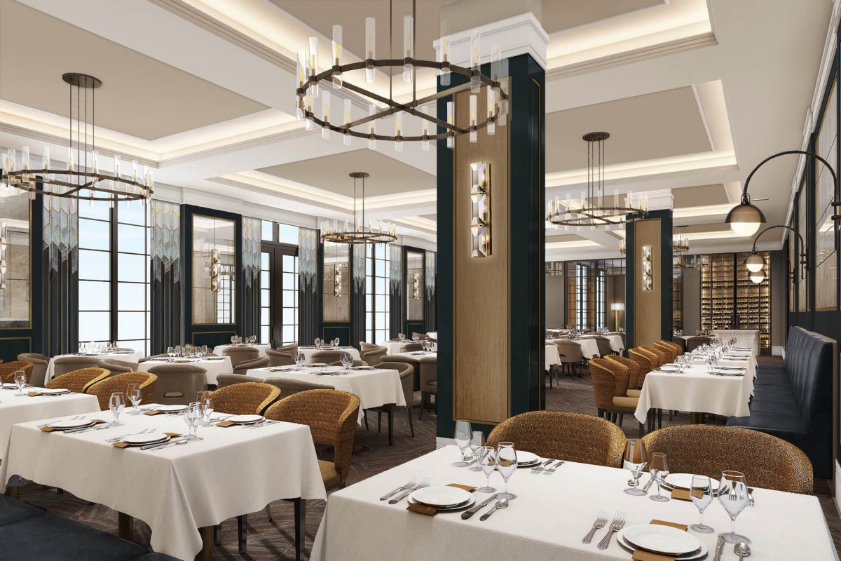 A modern and elegant restaurant interior with neatly arranged tables and chandeliers.