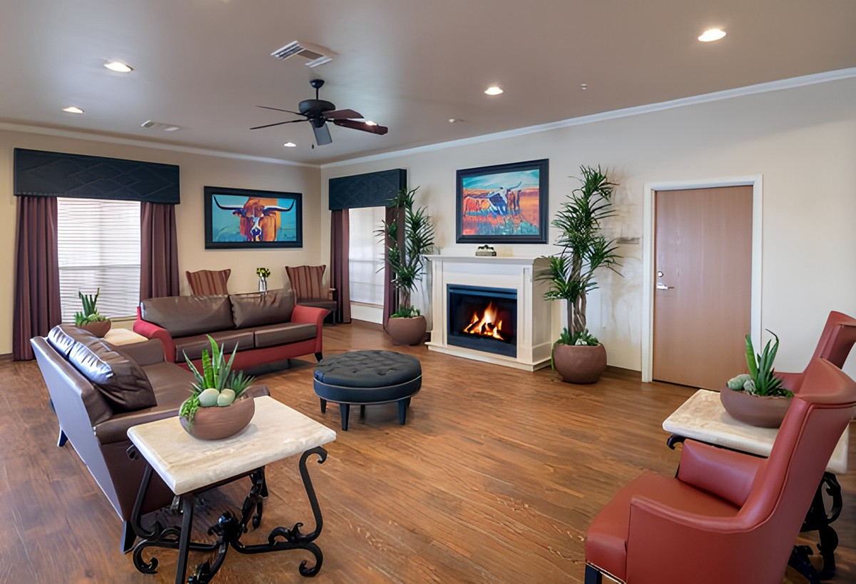 A cozy and well-decorated living room with a fireplace and comfortable seating.