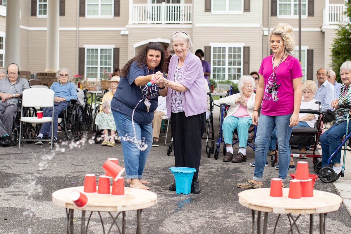 A group enjoying a fun outdoor activity at a community event for seniors.