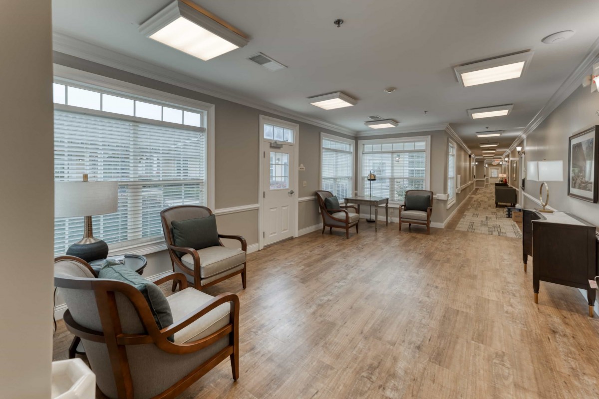A spacious lobby with comfortable seating and large windows.