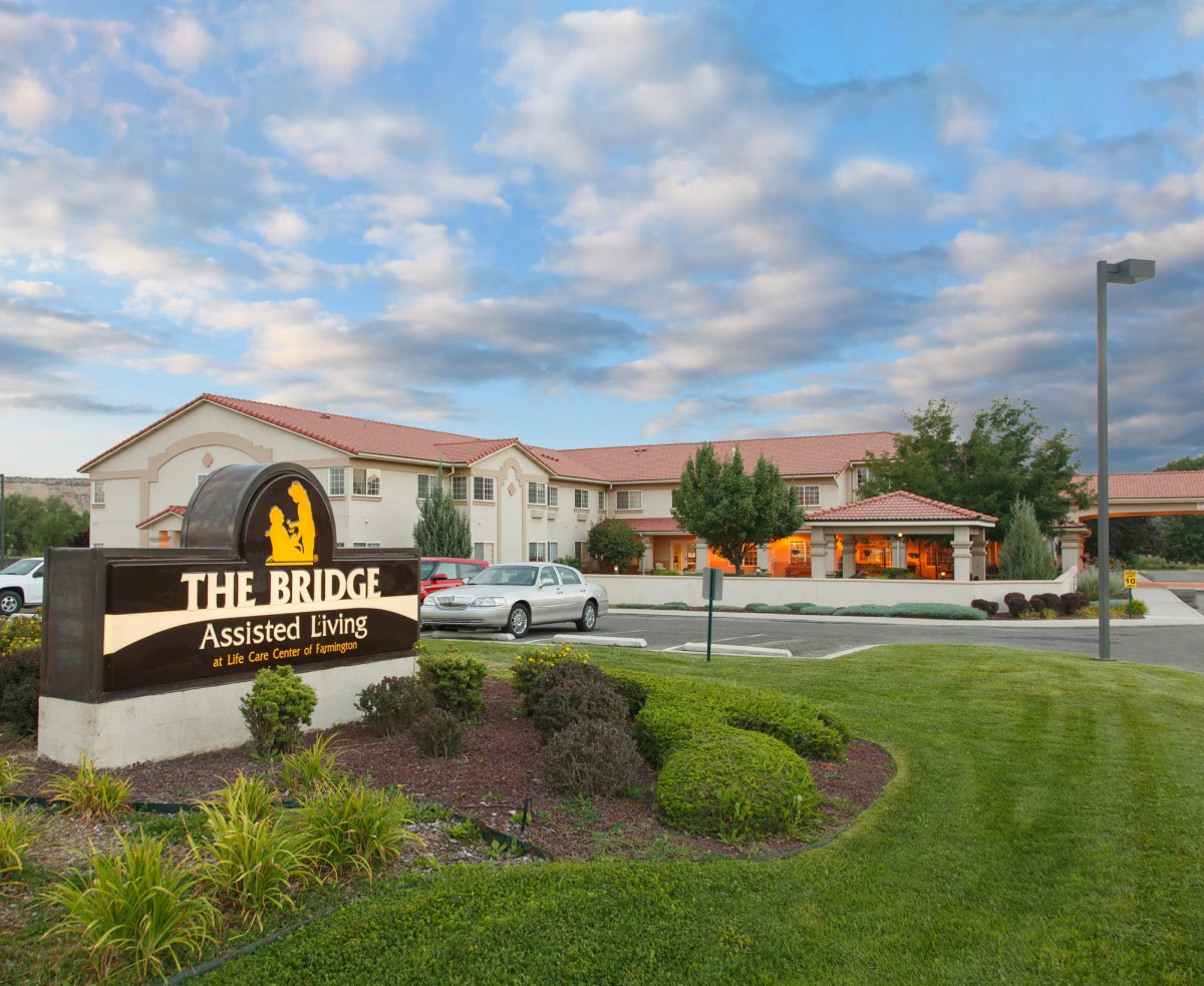 The Bridge Assisted Living facility under a partly cloudy sky.