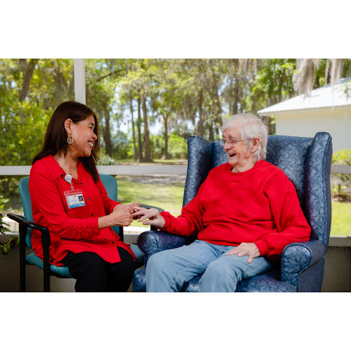 A caregiver shares a joyful moment with an elderly individual, showcasing compassion and connection.