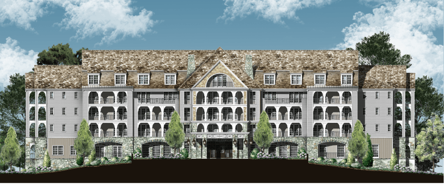 A traditional multi-story hotel building surrounded by trees under a clear blue sky.
