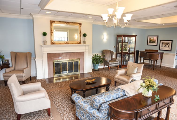 Elegant living room with a classic fireplace and comfortable seating.