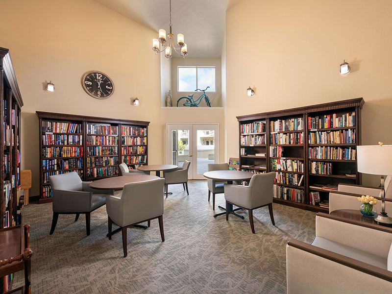 A cozy library interior with bookshelves and a comfortable reading area.