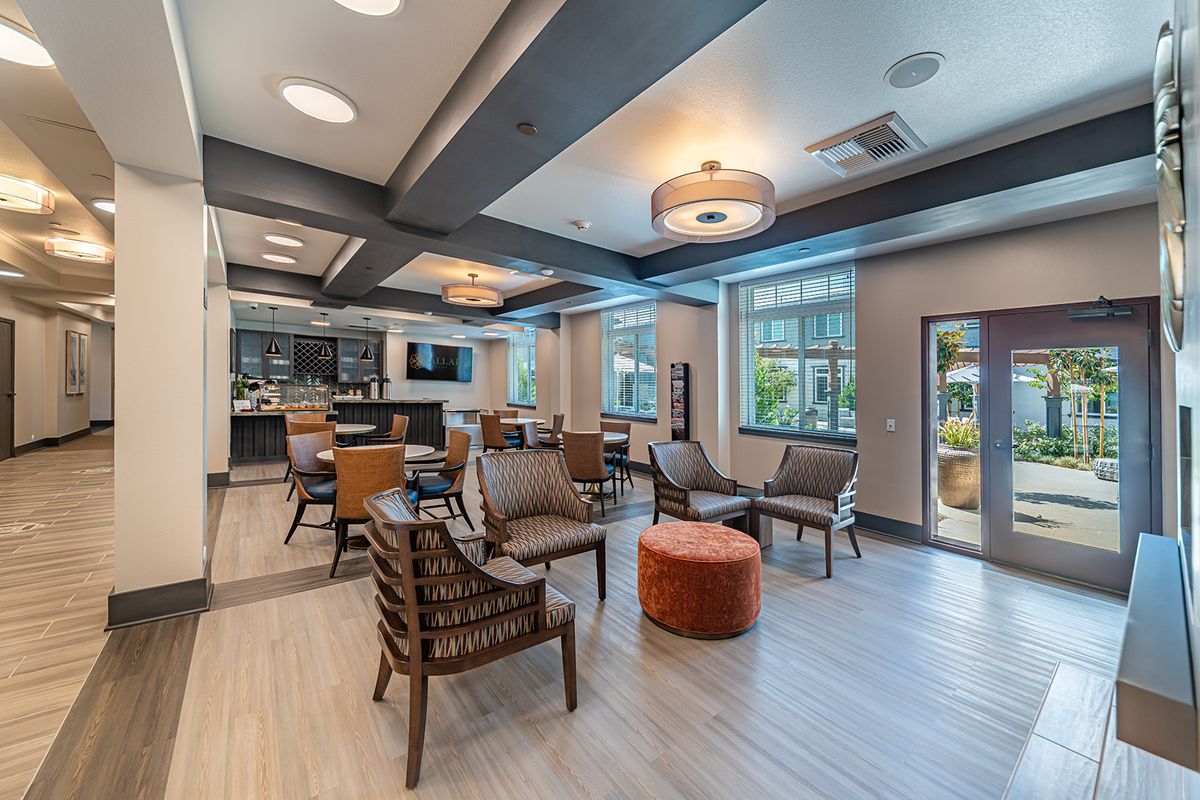 A modern lounge area with comfortable seating and natural lighting.