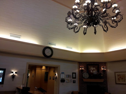 An elegantly designed interior featuring a decorative chandelier and ambient lighting.