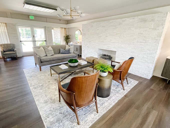 A modern living room with sleek furniture and a cozy atmosphere.