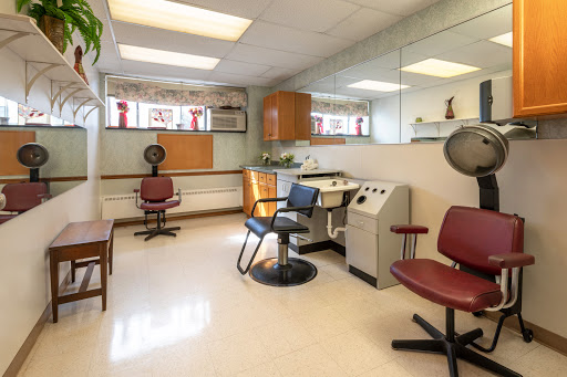 A tranquil healthcare space featuring salon-style chairs and medical equipment.