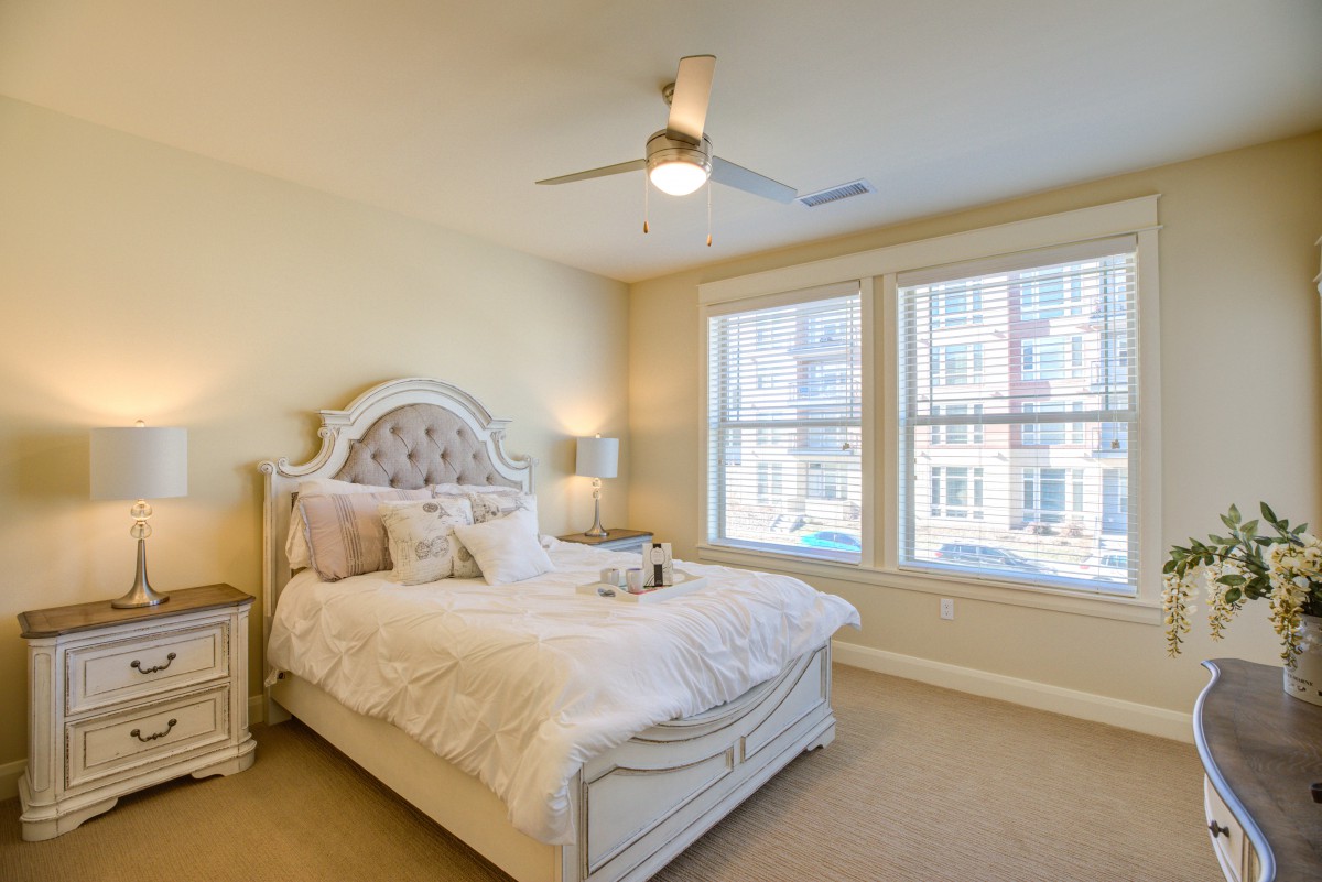 A cozy and well-lit bedroom with elegant decor.