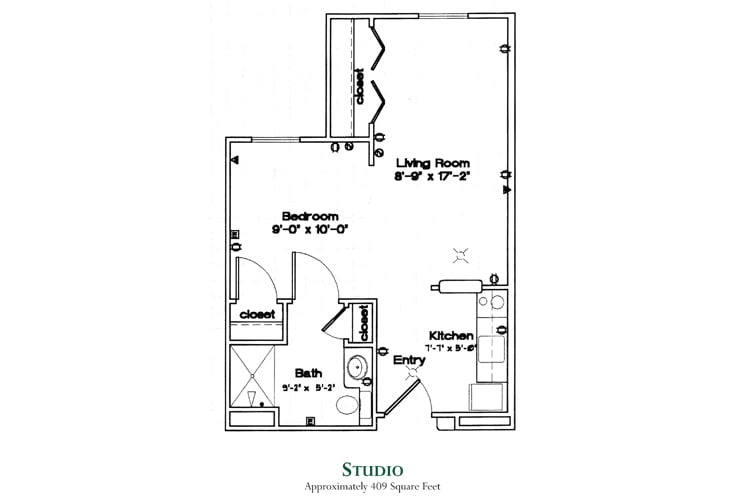 Studio apartment floor plan showing the layout of a living room, kitchen, bathroom, and bedroom area.