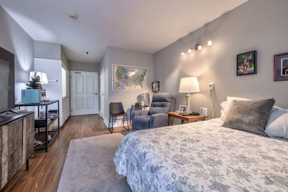 A modern and cozy bedroom with elegant furnishings and soft lighting.