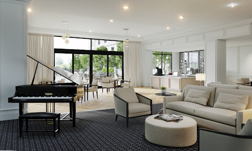 A stylish and spacious living room featuring modern furnishings and abundant natural light.