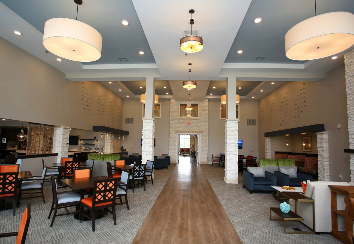 Spacious lobby area with elegant seating and decorative lighting.