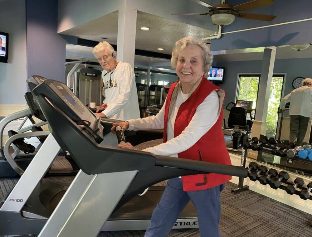 Seniors enjoying a workout at the gym.