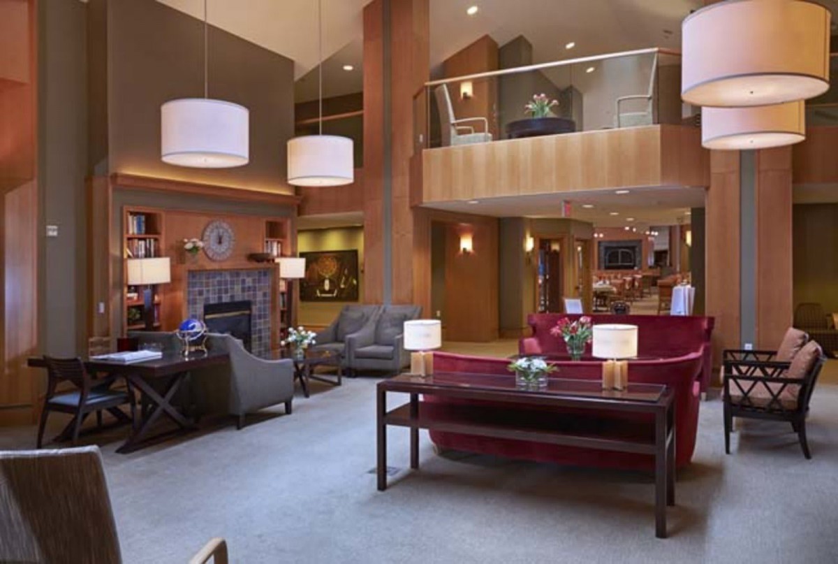 A modern and cozy hotel lobby with comfortable seating and stylish lighting.