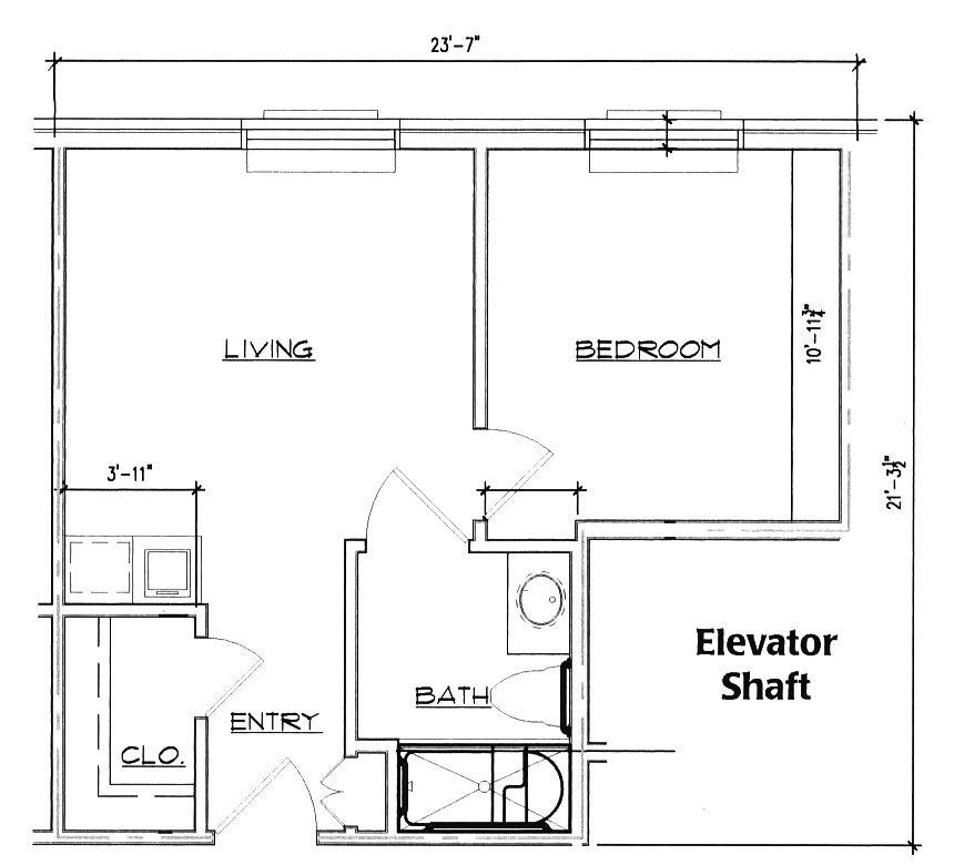 A floor plan depicting an apartment layout with a living room, bedroom, bathroom, and elevator shaft.