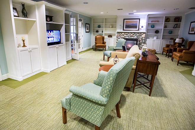 A cozy living room with comfortable seating and a television.