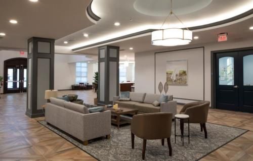 A modern living room with stylish furniture and lighting.