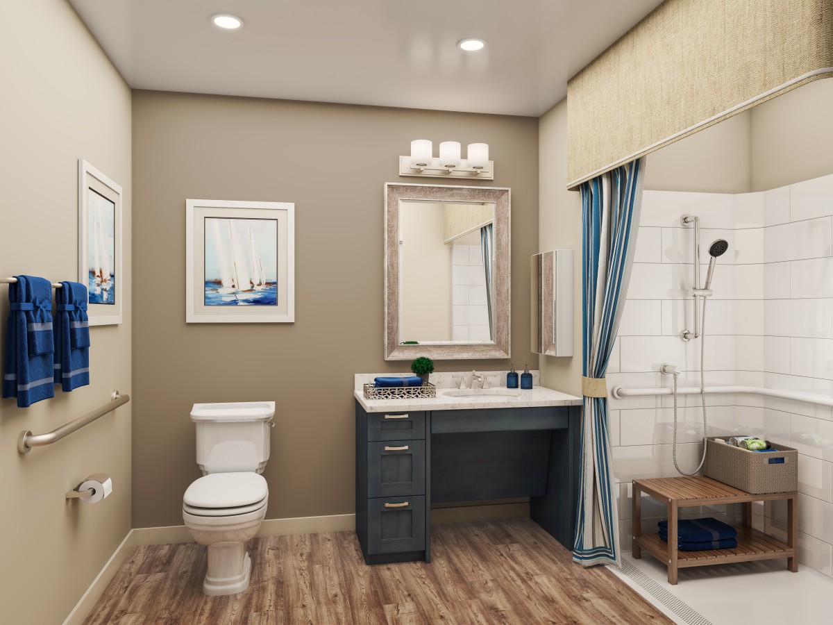 A modern bathroom interior featuring a toilet, vanity with a mirror, and a shower with blue curtains.