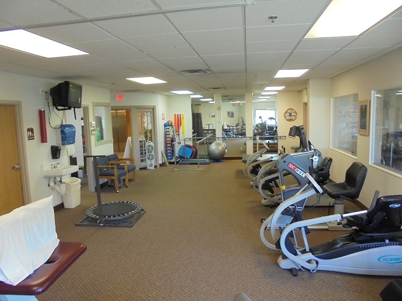 An indoor fitness center equipped with various exercise machines.