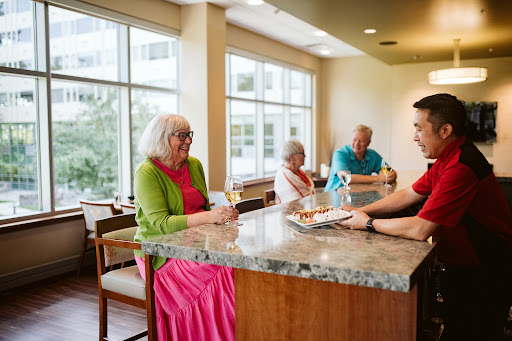 A warm and engaging atmosphere in a caf where seniors enjoy conversation and drinks.