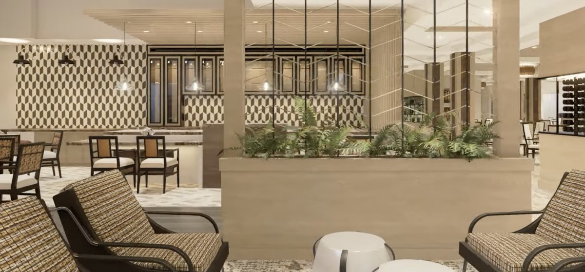 A modern lounge area with comfortable seating and a stylish bar in the background.
