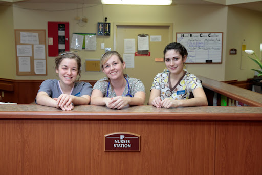 Friendly hospital staff at the reception desk.