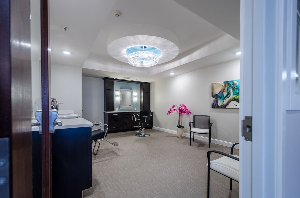 A modern office interior with stylish furniture and vibrant artwork.