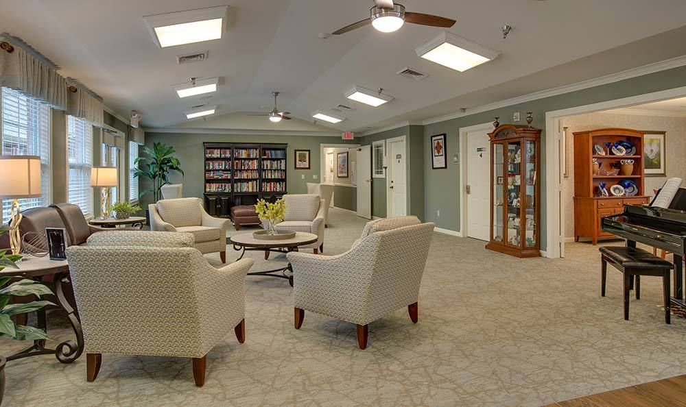 Modern lobby with comfortable seating and a small library.