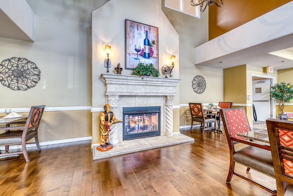 Elegant living room with a central fireplace and tasteful decor.