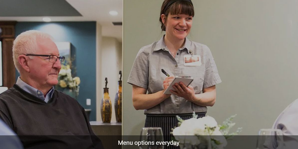 A waitress taking an order at a restaurant.