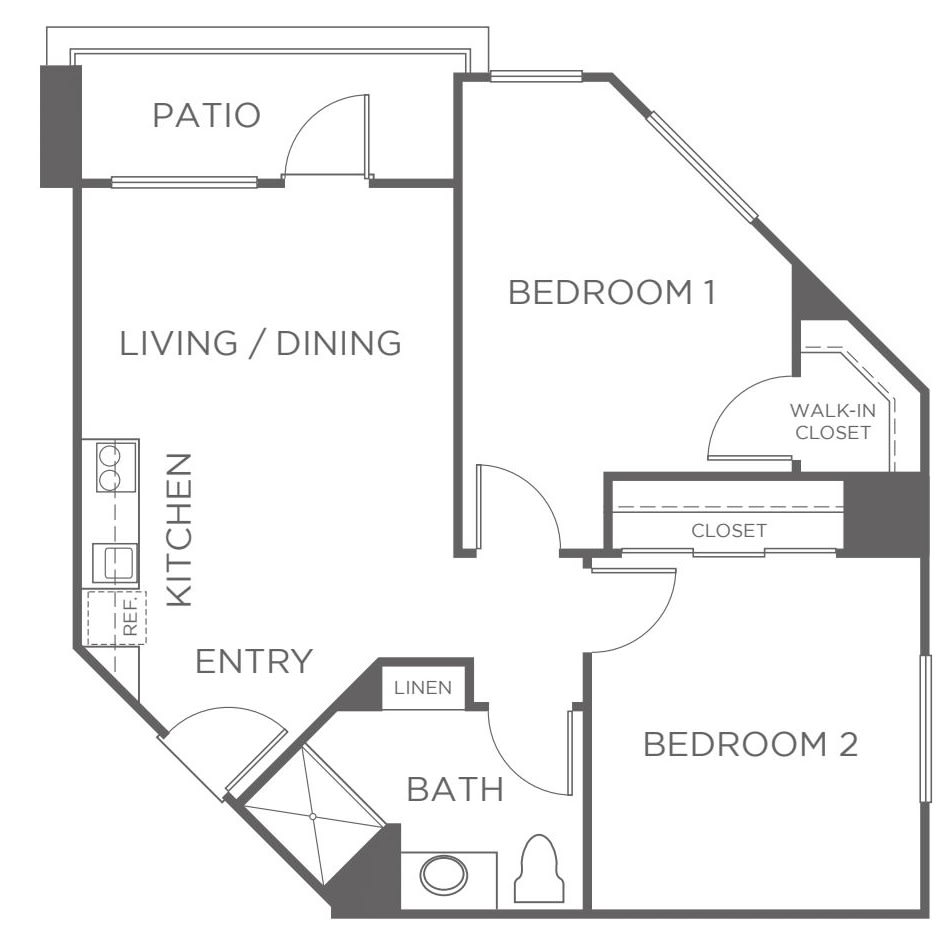 A floor plan of a two-bedroom apartment featuring a living/dining area, kitchen, bathroom, and patio.