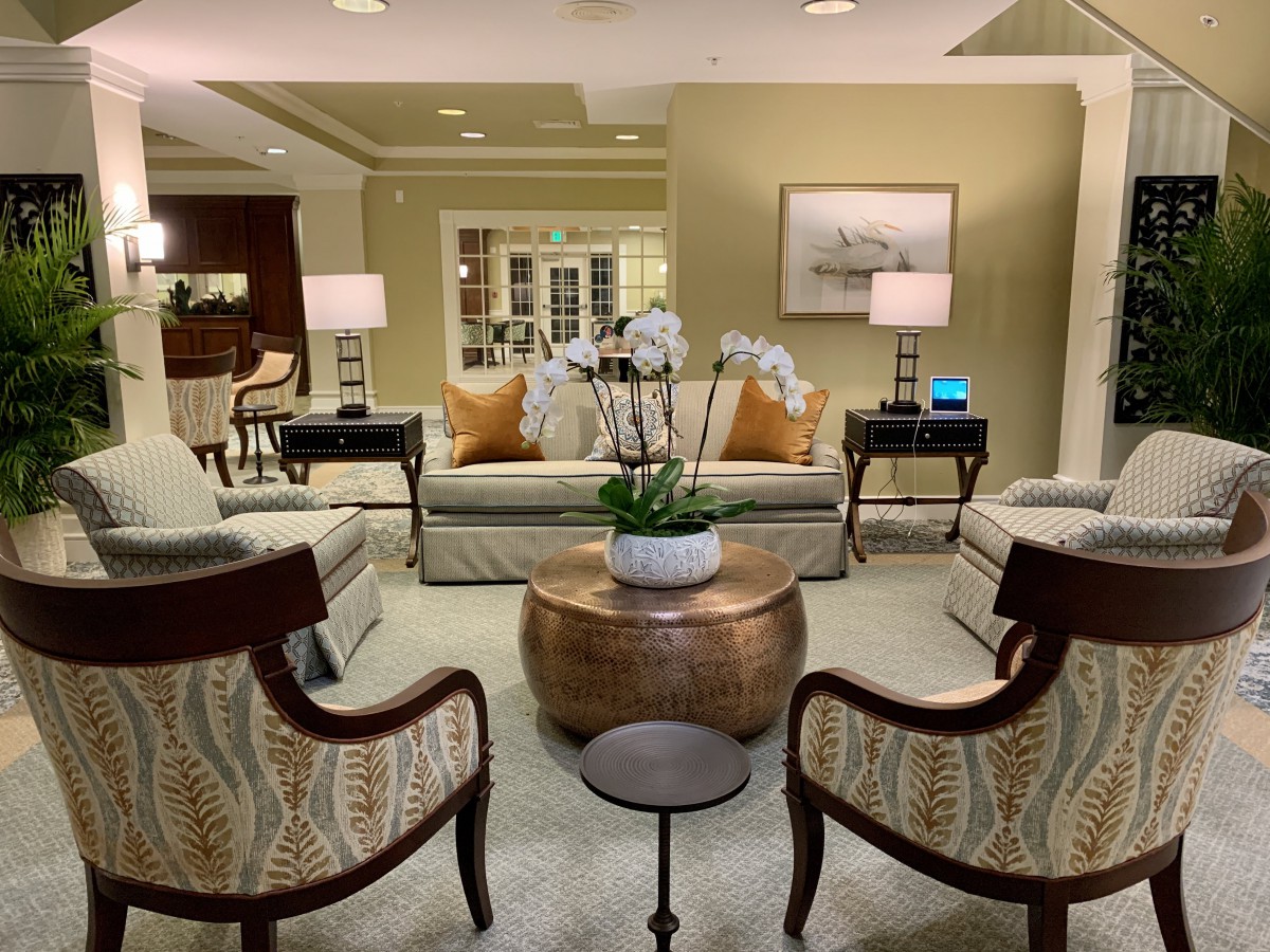 A cozy and elegantly designed living room with comfortable seating and warm lighting.