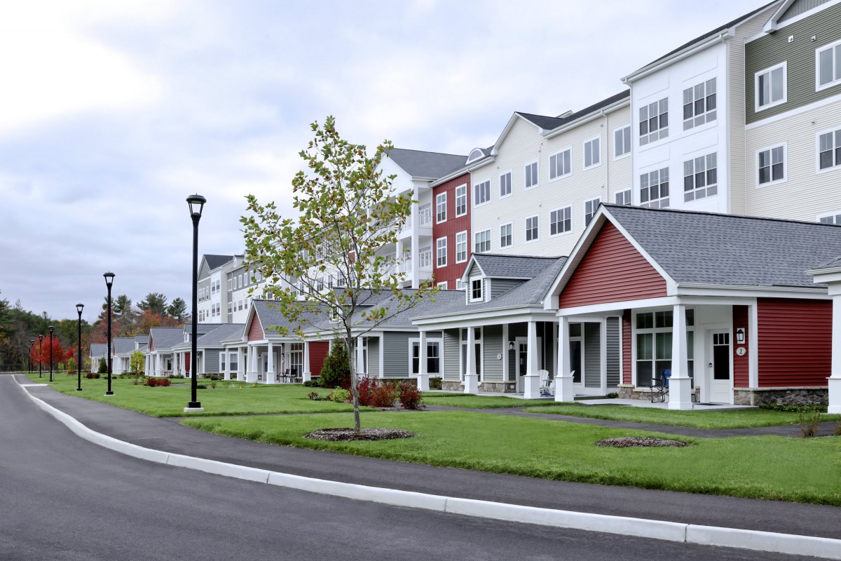 A modern residential housing complex with well-maintained landscaping.