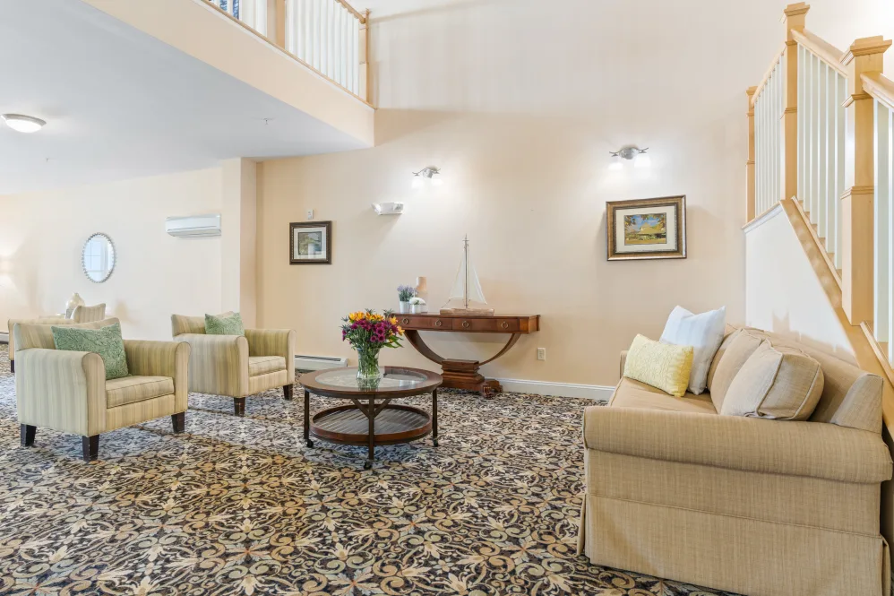 A well-lit living room with comfortable seating and elegant decor.