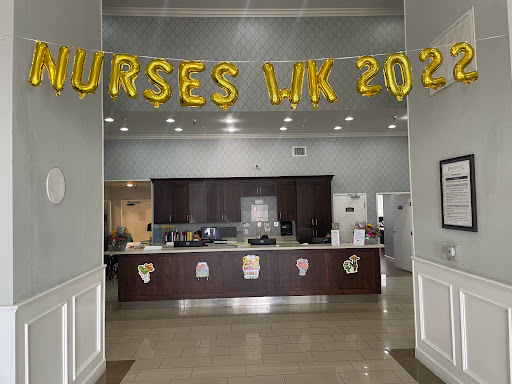 A festive display celebrating Nurses Week with golden balloons and a warm atmosphere.