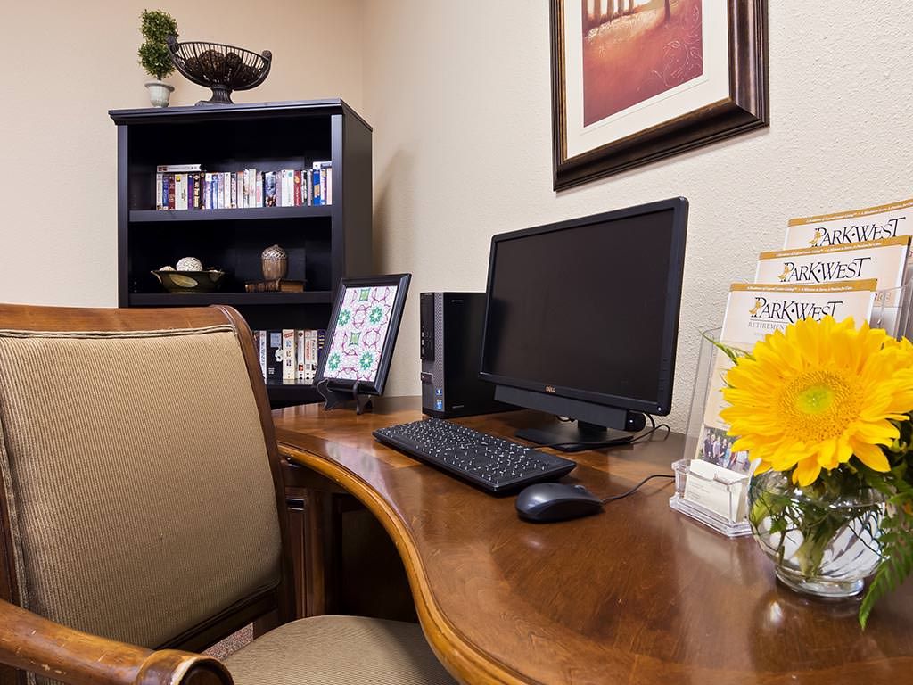 A tidy office workspace with a computer setup and decorative elements.
