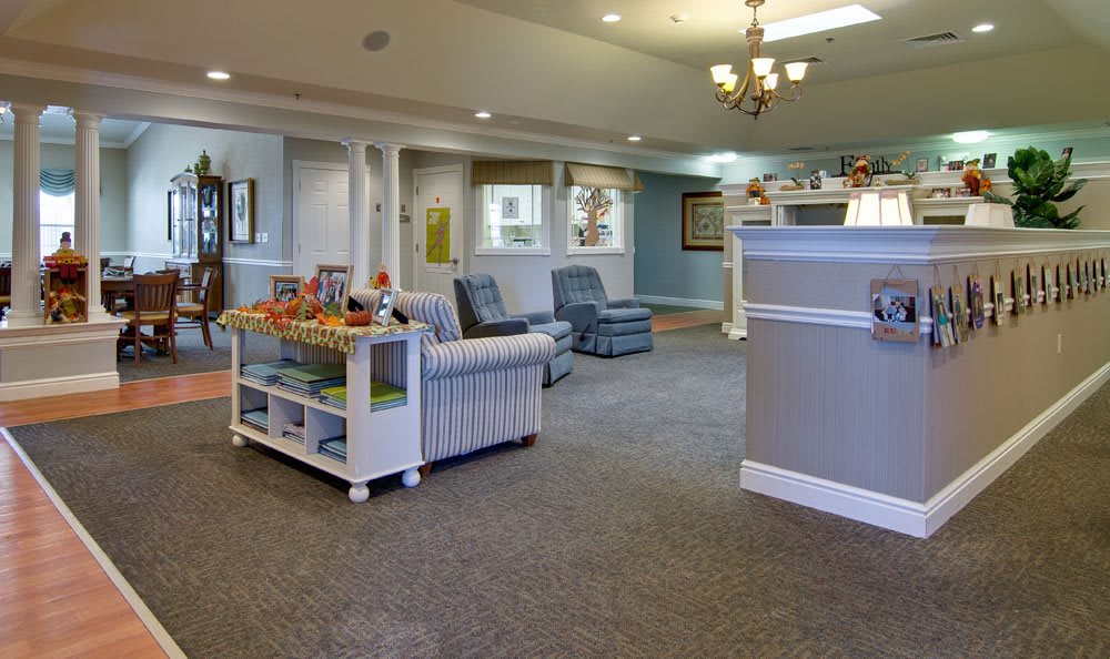 A welcoming and brightly lit waiting room with comfortable seating and children's toys.