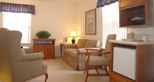 A cozy living room with comfortable furniture and warm lighting.